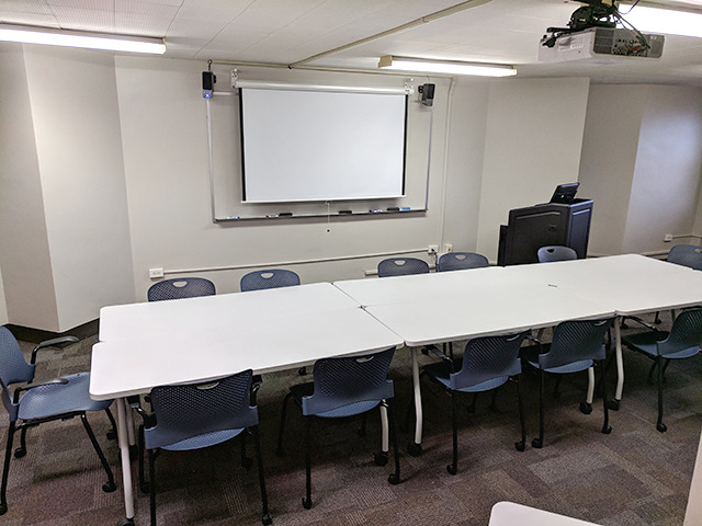 Choate 260 has 8' of whiteboard space on the front wall.